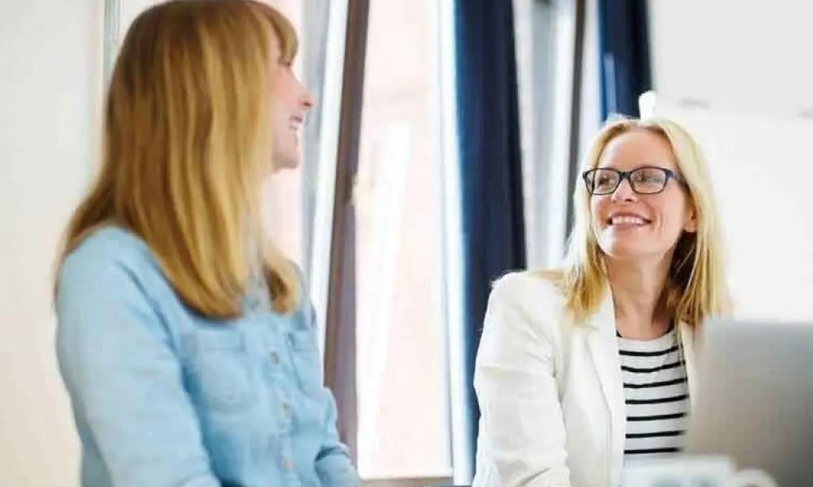 businesswomen discussing in office low 1000 667