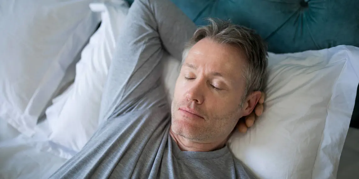 Man sleeping on bed