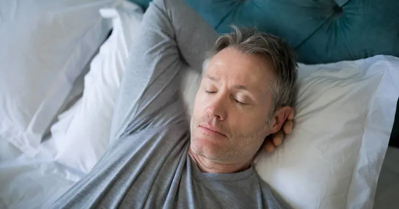 Man sleeping on bed